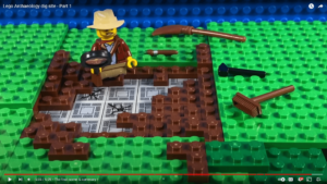 Video screenshot, showing an archaeological dig made of LEGO
