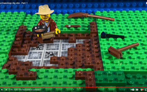 Video screenshot, showing an archaeological dig made of LEGO
