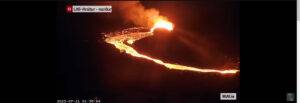 Screenshot from a video of the Volcanic Eruption at Litli-Hrútur, Iceland in 2023, showing lava glowing in the dark
